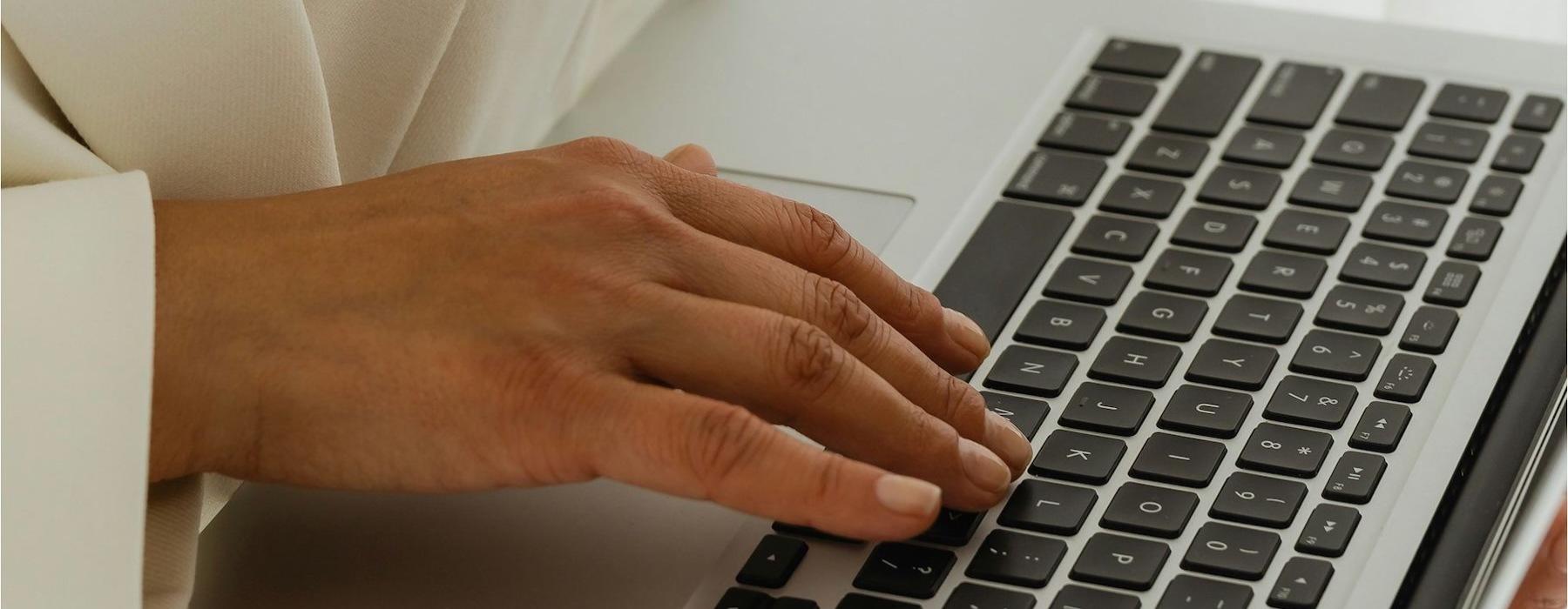a person typing on a laptop
