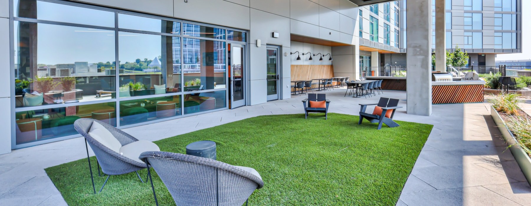 a building with a patio and chairs