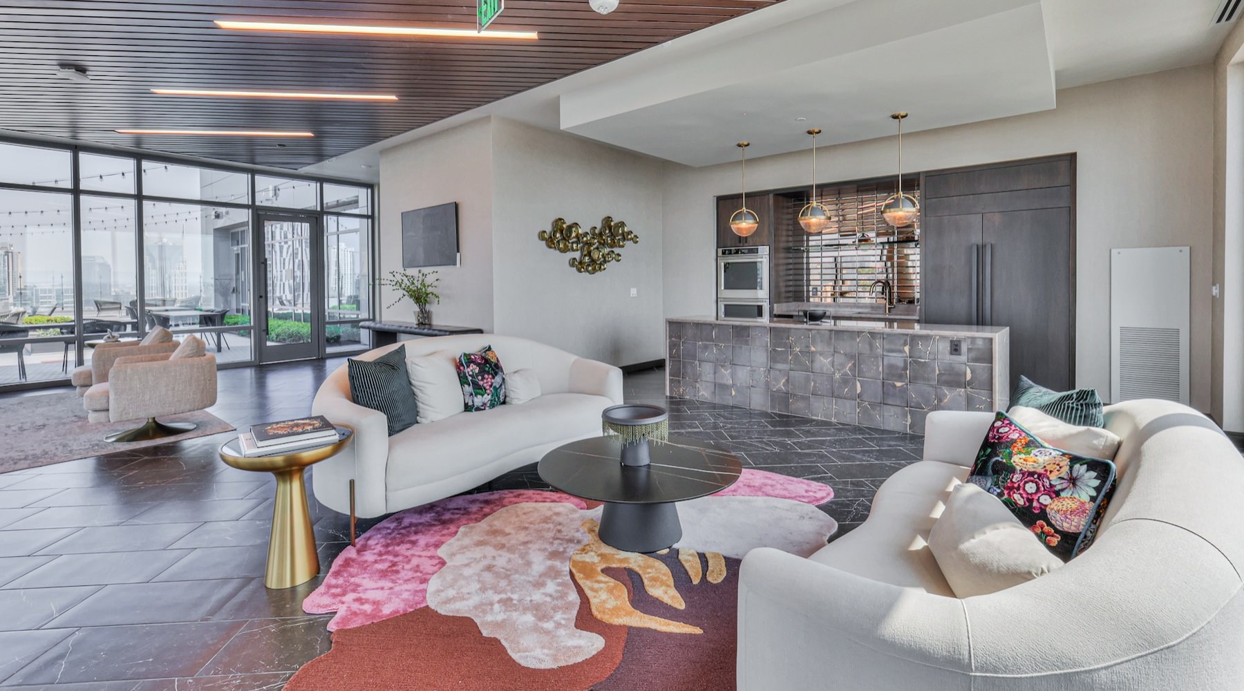 a lounge with couches, tables and chairs